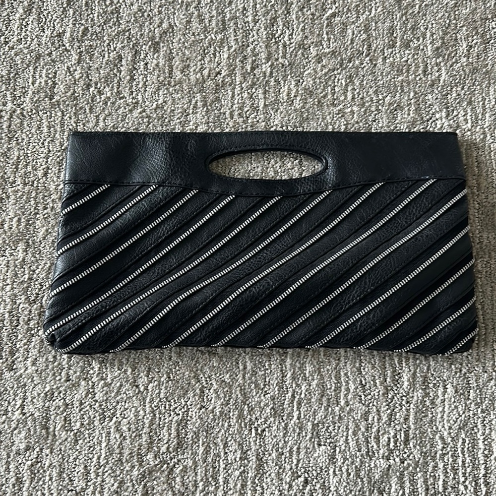Black clutch with zipper accents on front